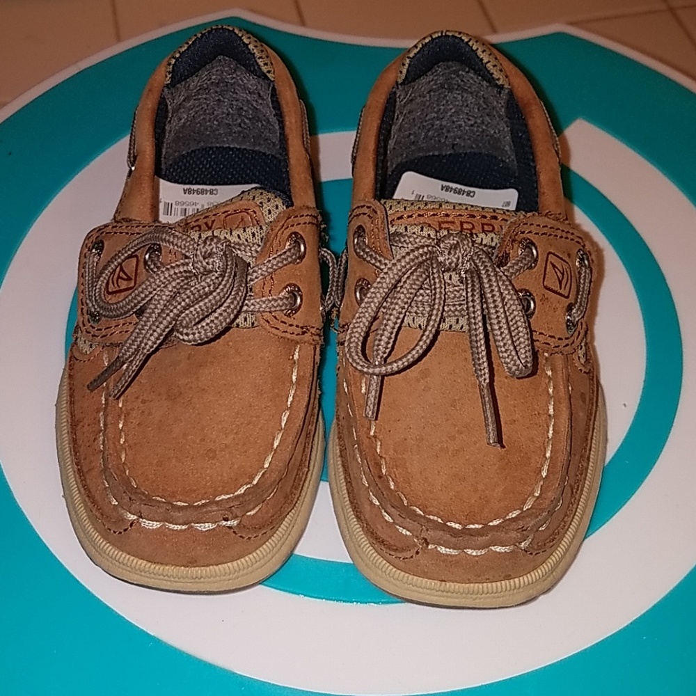 Worn boy Sperry boat shoes